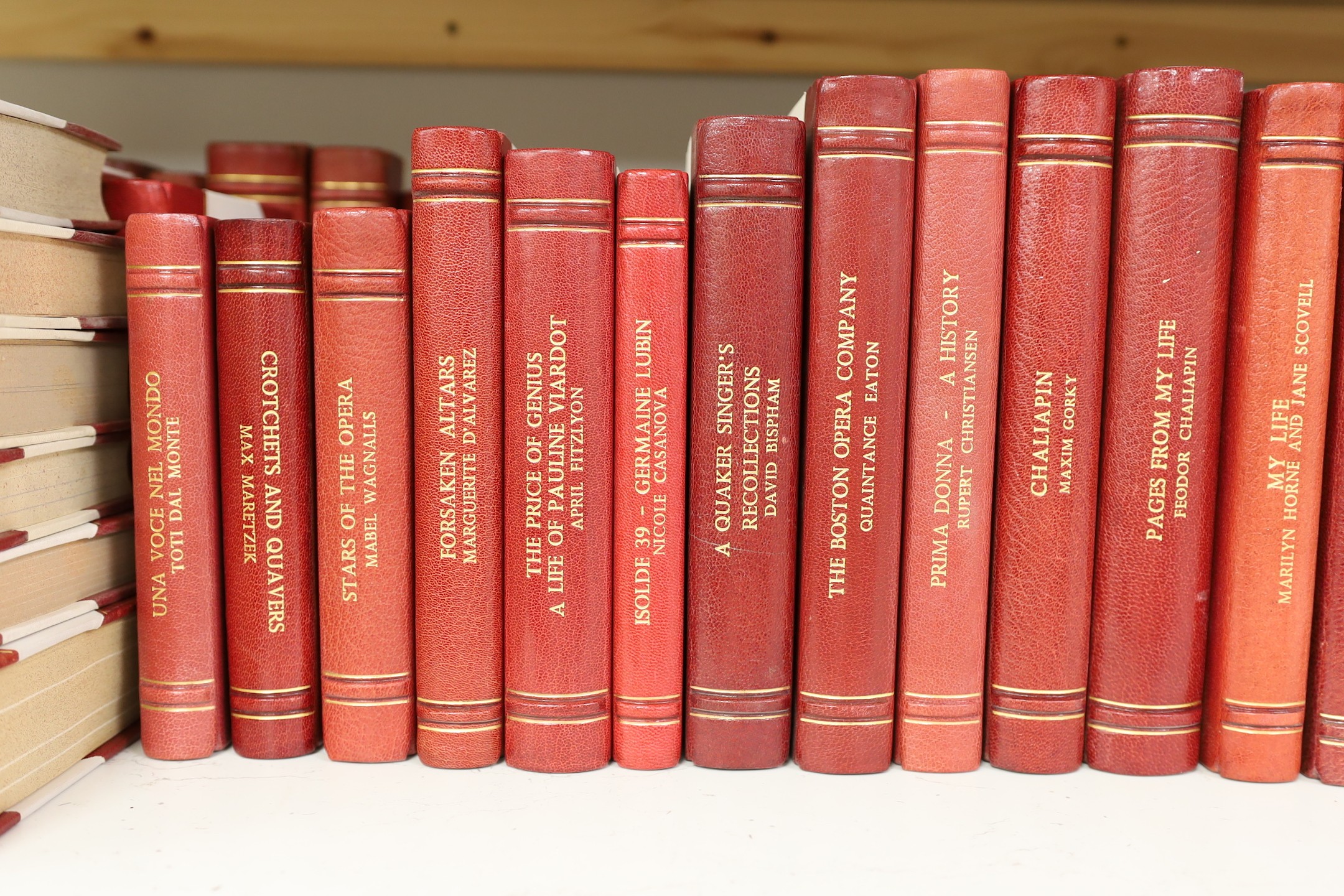 A collection of 19th and 20th century works on opera related biographies, autobiographies and histories, bound in red morocco by EA Weeks, London, approx 66 altogether